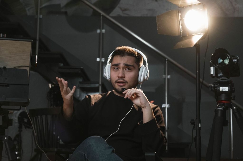 Man wearing headphones in a broadcast studio