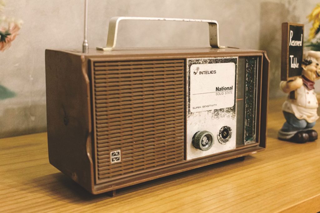 A vintage analog radio on a wooden table